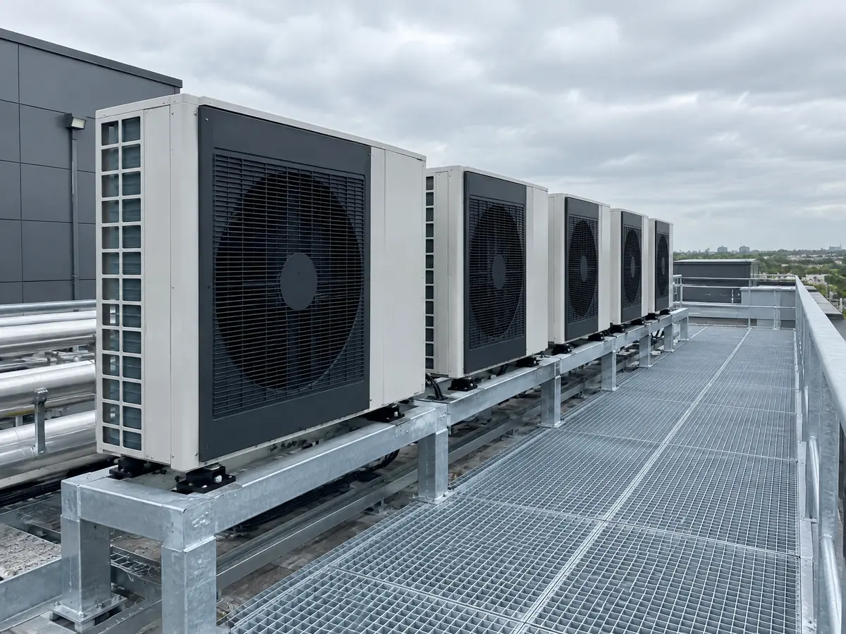 Air-source heat pump units on a commercial roof plant deck